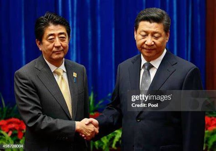 Abe shakes hands with&nbsp;China's President Xi Jinping in Beijing on November 10, 2014